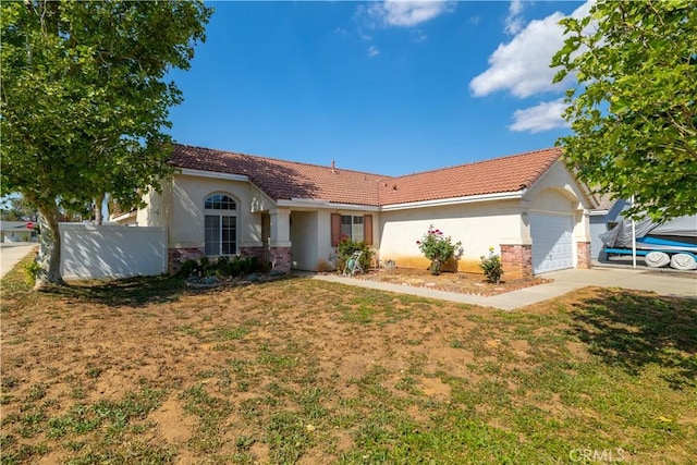 25714 Sunnyvale Ct, Menifee, CA 92584 - single story home with brick siding, a garage, a front yard, and stucco siding