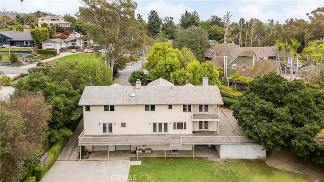 birds eye view of property with a residential view