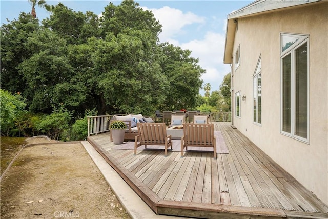 wooden deck featuring an outdoor living space