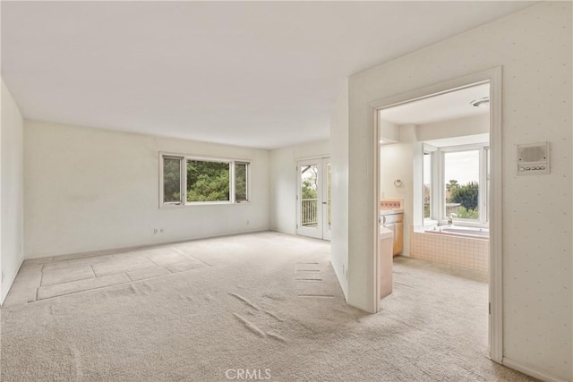 unfurnished living room with carpet flooring