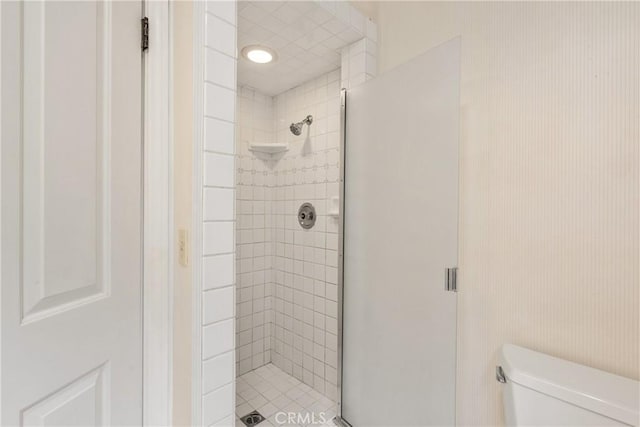 full bath with a shower stall and toilet