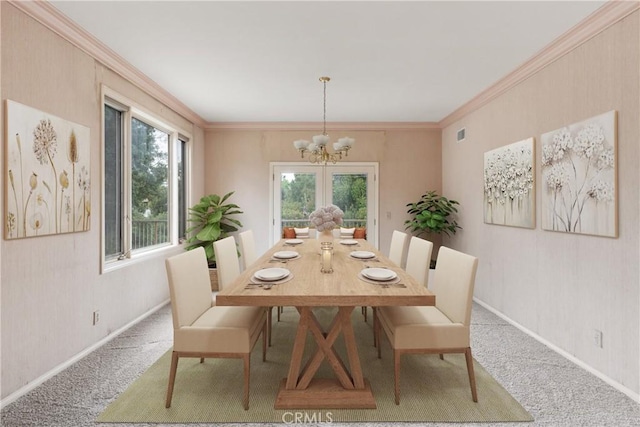 dining space with baseboards, carpet flooring, a chandelier, and crown molding