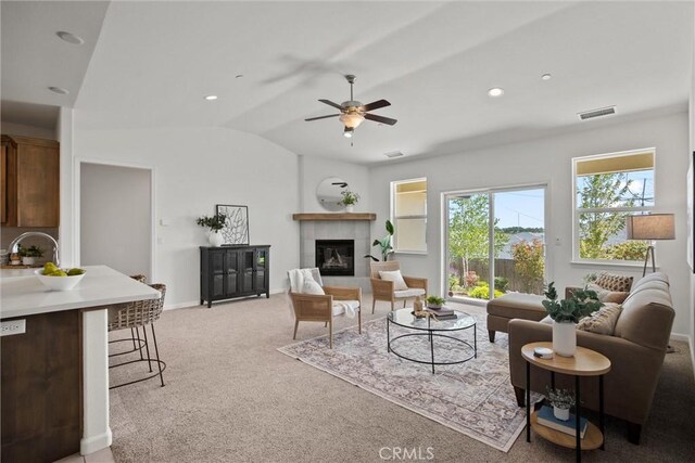 2991 Longwood Dr, Chico, CA 95928 - living room with a ceiling fan, visible vents, light carpet, and lofted ceiling