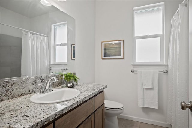 full bathroom featuring toilet, tile patterned floors, and vanity