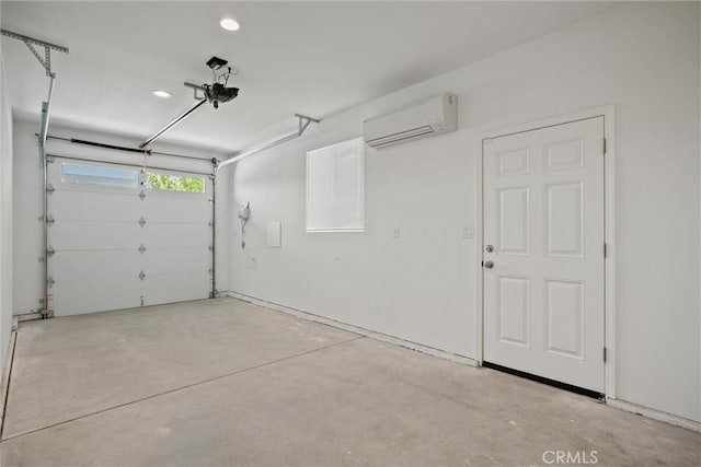 garage featuring recessed lighting and a wall unit AC