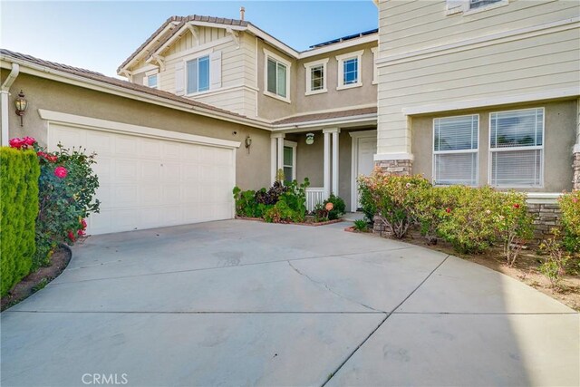 29444 Siderite Cir, Menifee, CA 92584 - view of front of home featuring a garage, stucco siding, and concrete driveway