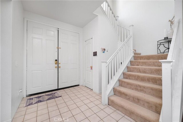 29444 Siderite Cir, Menifee, CA 92584 - foyer featuring light tile patterned flooring and stairway