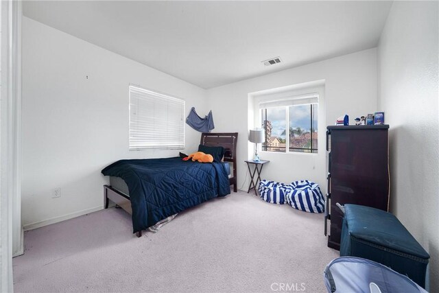 29444 Siderite Cir, Menifee, CA 92584 - bedroom with baseboards, visible vents, and carpet