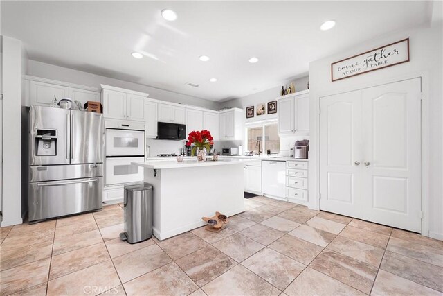 29444 Siderite Cir, Menifee, CA 92584 - kitchen with light countertops, recessed lighting, white cabinets, and white appliances