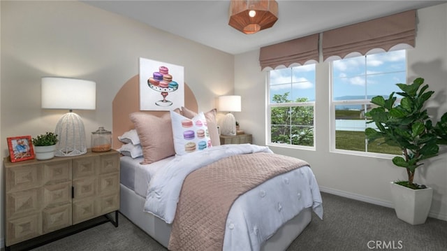 carpeted bedroom featuring baseboards