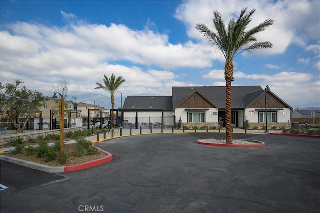 view of property featuring a residential view and fence