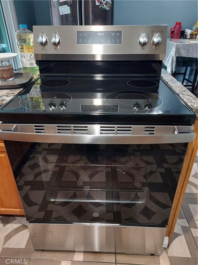 room details with stainless steel electric stove