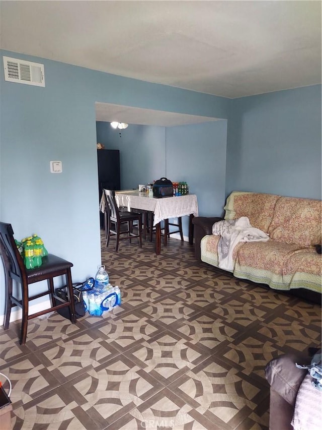 living room featuring visible vents
