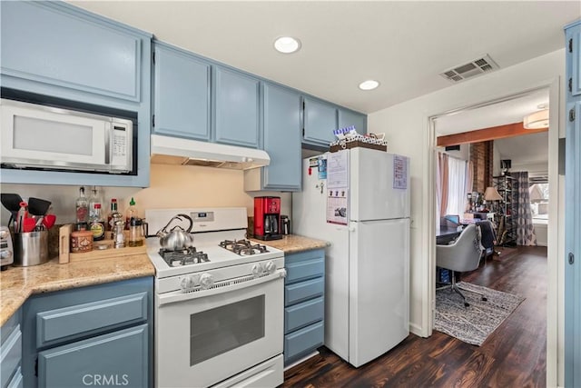 kitchen featuring blue cabinets, under cabinet range hood, and white appliances