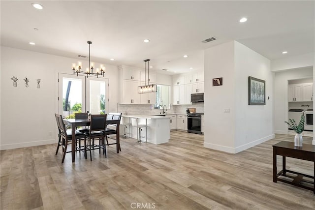 1830 Apple View Way, Paradise, CA 95969 - dining room featuring a chandelier, baseboards, light wood finished floors, and recessed lighting