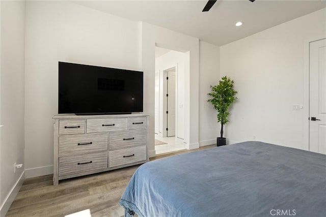 bedroom with a ceiling fan, light wood finished floors, recessed lighting, and baseboards
