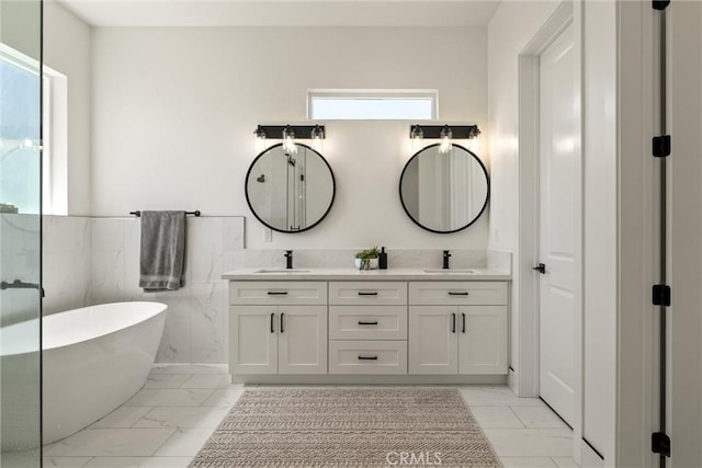 1830 Apple View Way, Paradise, CA 95969 - full bathroom with marble finish floors, a freestanding bath, double vanity, wainscoting, and tile walls
