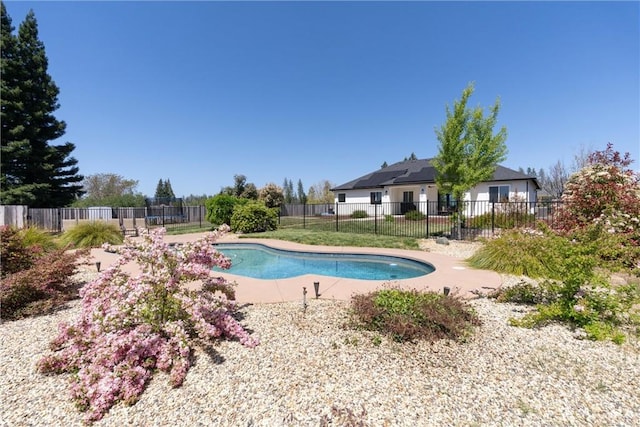 view of swimming pool featuring fence and a fenced in pool