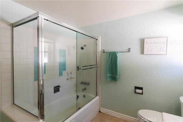 2812 Sunnywood Dr, Fullerton, CA 92835 - bathroom featuring toilet, shower / bath combination with glass door, and baseboards