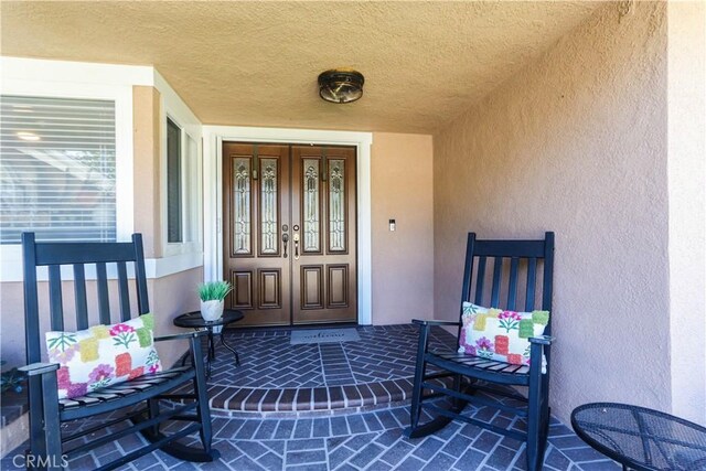 2812 Sunnywood Dr, Fullerton, CA 92835 - property entrance with french doors and stucco siding