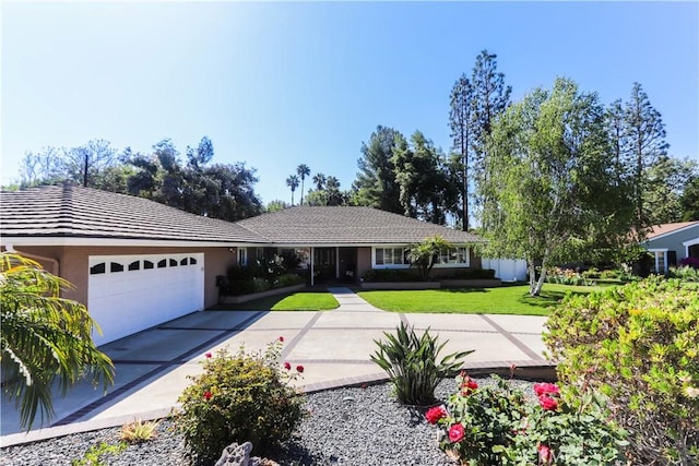 2812 Sunnywood Dr, Fullerton, CA 92835 - ranch-style home featuring a garage, driveway, a front yard, and stucco siding