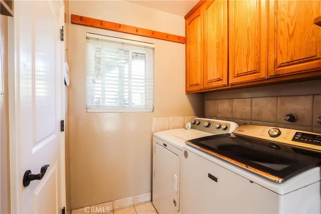 2812 Sunnywood Dr, Fullerton, CA 92835 - clothes washing area with washing machine and dryer, light tile patterned floors, and cabinet space