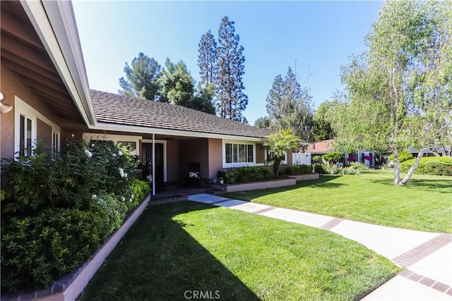 2812 Sunnywood Dr, Fullerton, CA 92835 - ranch-style house featuring a front yard and stucco siding