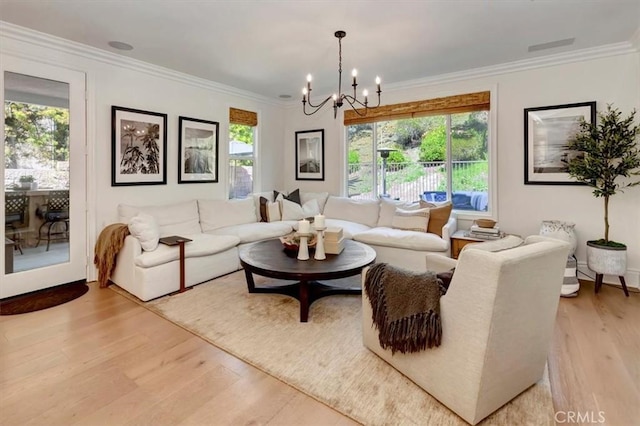 1711 Colina Terrestre, San Clemente, CA 92673 - living room with light wood finished floors, a chandelier, and crown molding