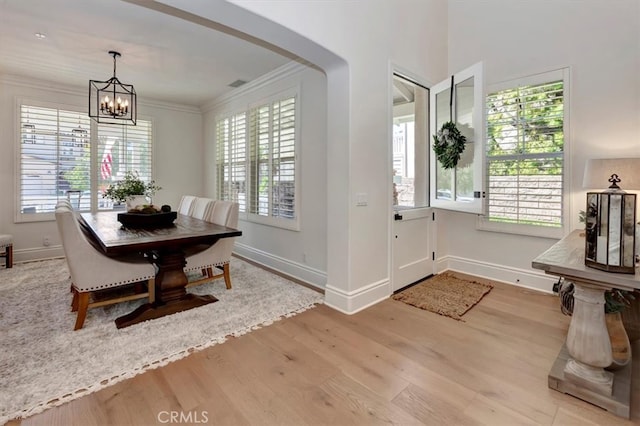1711 Colina Terrestre, San Clemente, CA 92673 - dining space with wood finished floors, a chandelier, crown molding, and arched walkways