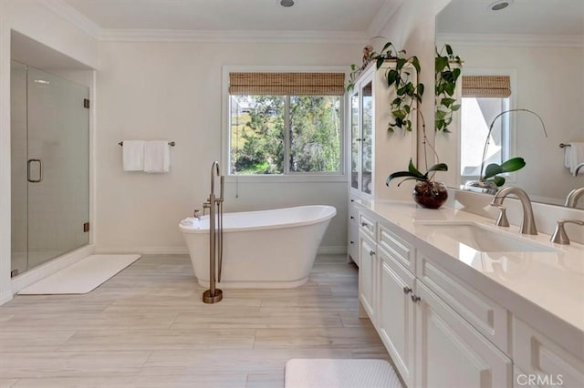 1711 Colina Terrestre, San Clemente, CA 92673 - bathroom with vanity, a shower stall, a soaking tub, wood finished floors, and crown molding