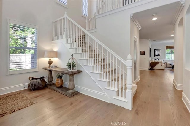 1711 Colina Terrestre, San Clemente, CA 92673 - stairway with wood finished floors, arched walkways, a towering ceiling, ornamental molding, and recessed lighting