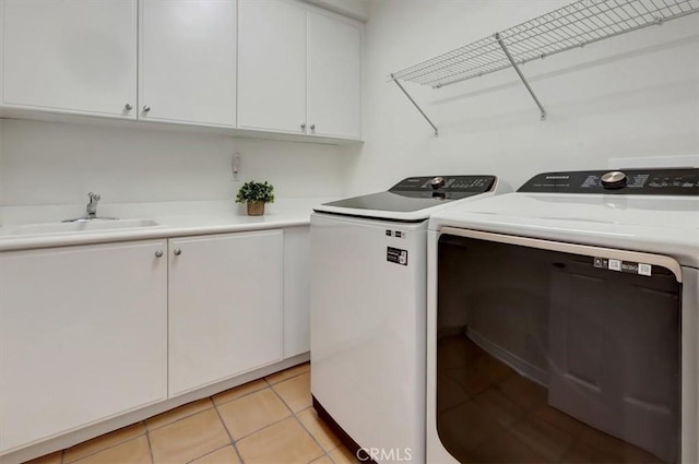 1711 Colina Terrestre, San Clemente, CA 92673 - laundry area featuring cabinet space, washing machine and dryer, and light tile patterned flooring
