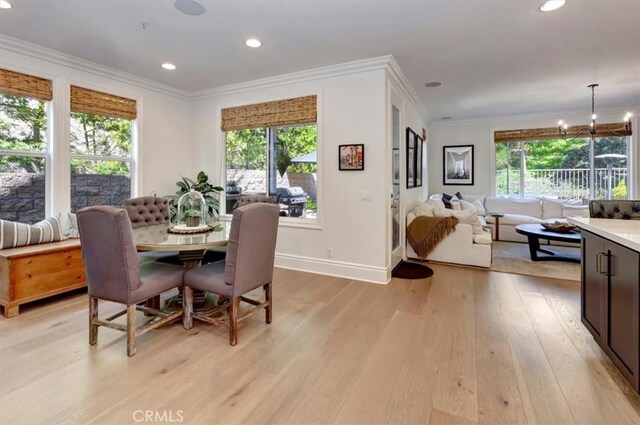 1711 Colina Terrestre, San Clemente, CA 92673 - dining room featuring light wood-style floors, crown molding, recessed lighting, and a chandelier