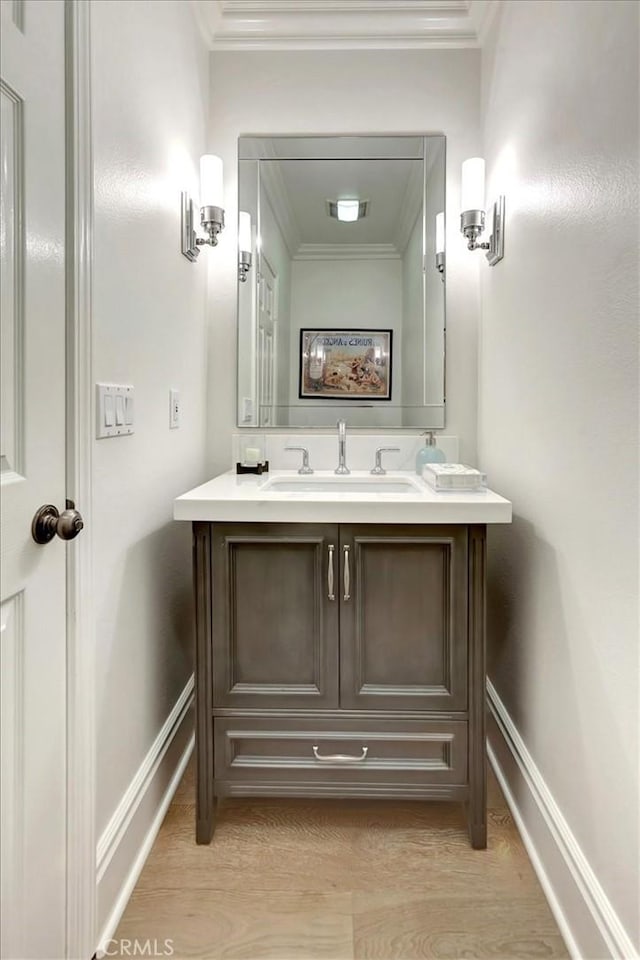 1711 Colina Terrestre, San Clemente, CA 92673 - bathroom with double vanity, crown molding, and wood finished floors