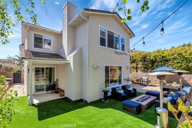 1711 Colina Terrestre, San Clemente, CA 92673 - rear view of property with a patio, stucco siding, a chimney, and an outdoor living space with a fire pit