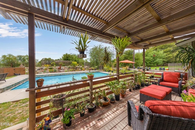 pool featuring fence and a deck