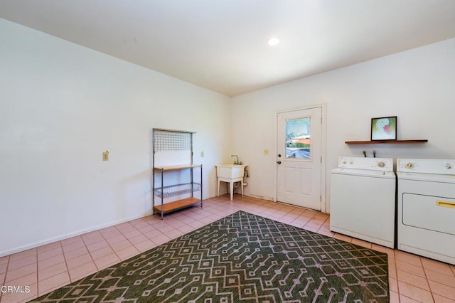 laundry room with light tile patterned floors, laundry area, and independent washer and dryer