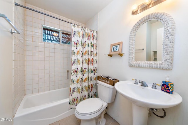 full bath featuring shower / bath combo, toilet, and tile patterned floors