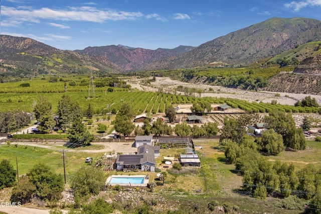 birds eye view of property featuring a rural view and a mountain view