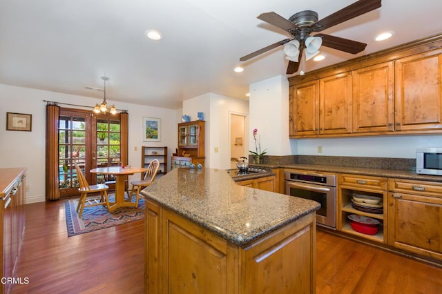 1526 Grand Ave, Fillmore, CA 93015 - kitchen with appliances with stainless steel finishes, brown cabinetry, dark wood-style flooring, a ceiling fan, and recessed lighting