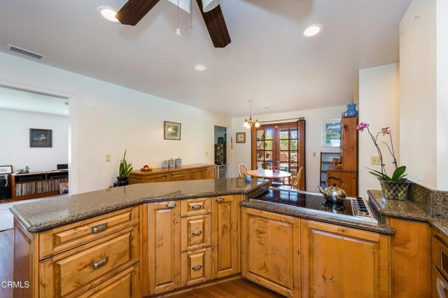 1526 Grand Ave, Fillmore, CA 93015 - kitchen with black stovetop, brown cabinets, dark wood-style floors, ceiling fan, and recessed lighting