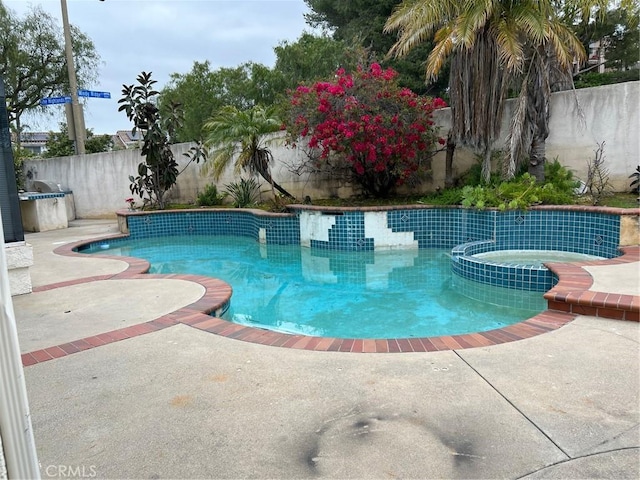 view of pool featuring a fenced in pool, a patio area, and a fenced backyard