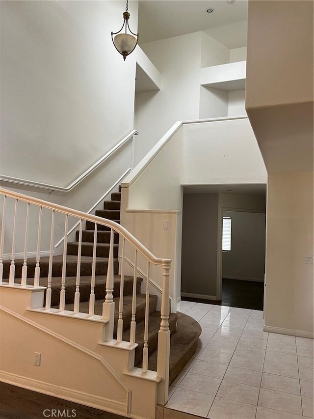 stairway featuring baseboards