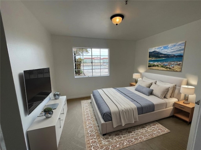 carpeted bedroom with baseboards