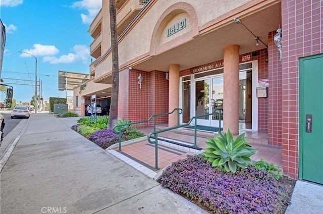 property entrance with brick siding