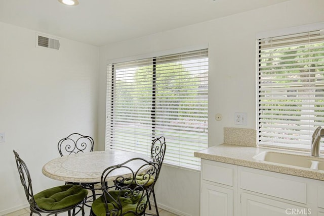 dining room with baseboards and visible vents