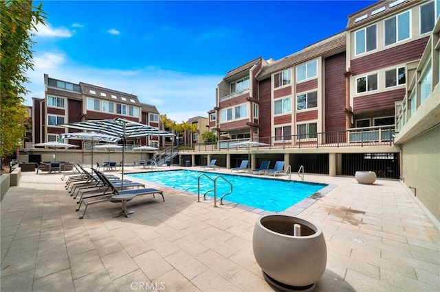 community pool featuring a patio area