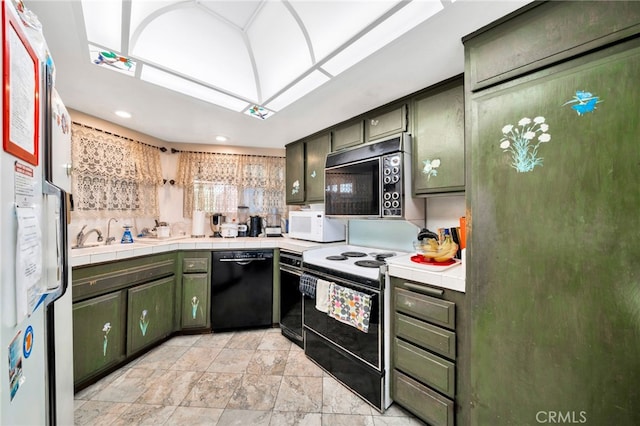 kitchen with green cabinets, a sink, tile countertops, and white appliances