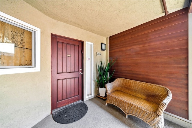 property entrance with stucco siding