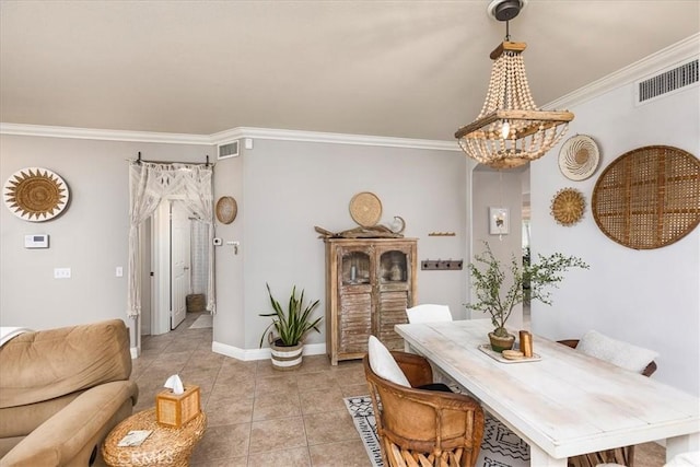 dining room with light tile patterned floors, ornamental molding, a notable chandelier, and visible vents